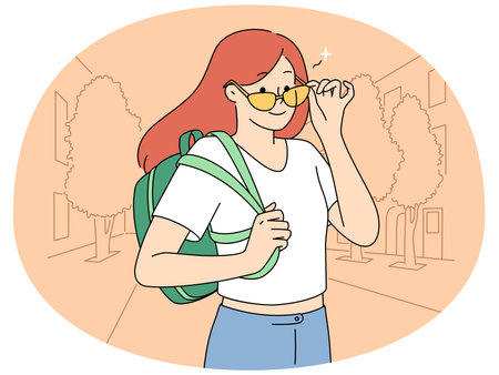 Smiling girl with backpack on streetのイラスト素材