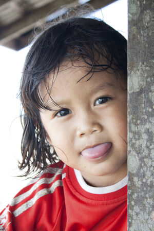 SARAWAK, MALAYSIA - JUNE 3  Unidentified cute young girl of the Land Dayak tribe in Sarawak, Malaysia on June 3, 2010  Land Dayak or Bidayuh is an indigenous groups found in southern Sarawak and northern West Kalimantan on the island of Borneoのeditorial素材