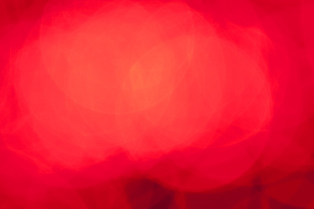 Red abstract background with defocused bokeh lightsの写真素材