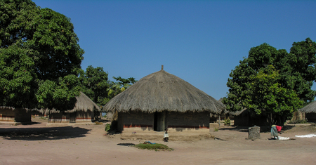 Near Pweto, Katanga, Democratic Republic of Congo, 11th June 2005: Woman and child standing next to their hutの写真素材