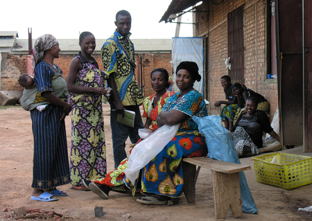 Lubumbashi, Democratic Republic of Congo, circa May 2006: Group of people smiling for the camera in an abandoned factory. In the  industrial quarter of the city there are several former factories now used as improvised living quartersのeditorial素材