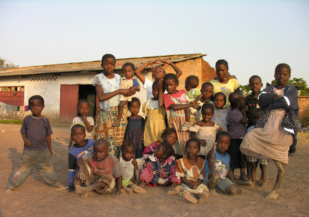 Lubumbashi, Democratic Republic of Congo, circa May 2006: Group of children posing for the camera in the yard of an abandoned factory. In the  industrial quarter of the city there are several former factories now reutilized as improvised living quartersのeditorial素材