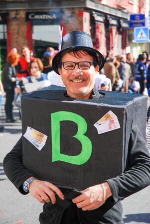 Madrid, Spain, March 2nd 2019: Carnival parade, Man disguised as bank posing for the cameraのeditorial素材