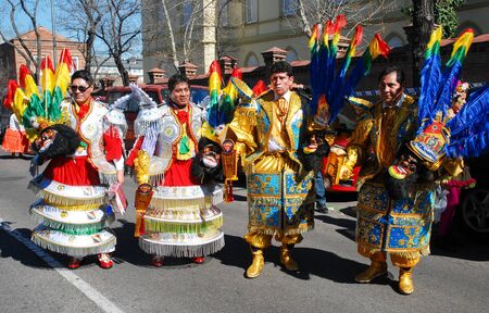 Madrid, Spain, March 2nd 2019: Carnival parade, Men from Bolivian dance group posing with traditional costumesのeditorial素材