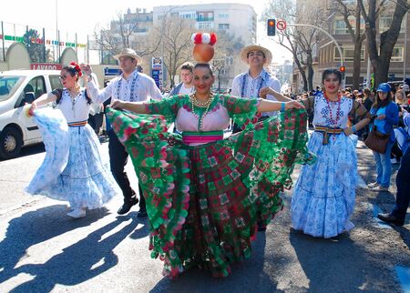 Madrid, Spain, March 2nd 2019: Carnival parade, members of Paraguayan dance group performing with traditional costumeのeditorial素材