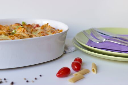 Gratin with pasta and cheese in white casserole.の写真素材
