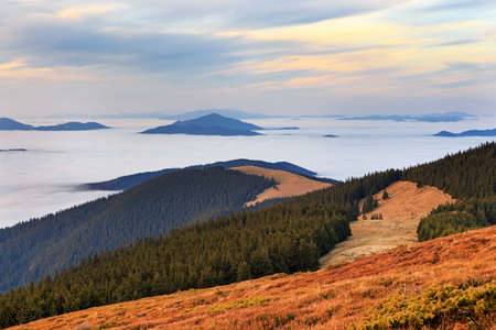 Panoramic scenery of the clouds and mountains at sunset