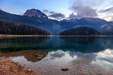 Evening over montenegro black lake and durmitor mountainの写真素材