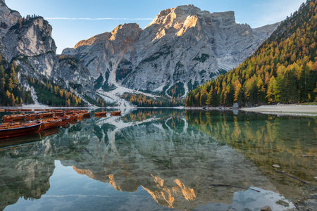 Lago di braies lake in the dolomites in autumn, reflection on the water, Italyの写真素材