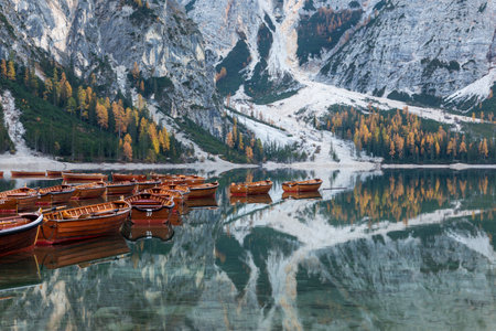 Lago di braies lake in the dolomites in autumn, reflection on the water, Italyの写真素材