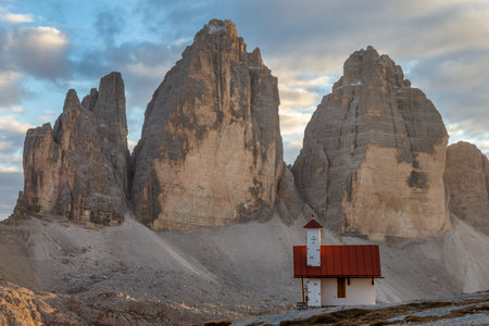Small chapel and Tre Cime Di Lavaredo peaks. Evening scene during sunset of Dolomite Alps, Italy, Europe.の写真素材
