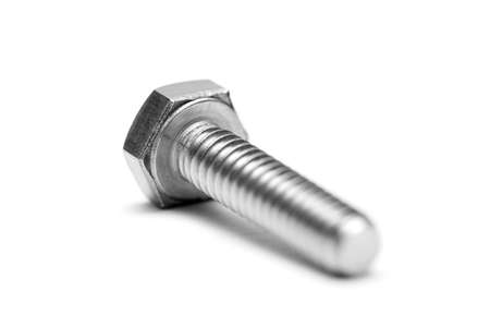 macro of a stainless steel bolt over whiteの写真素材