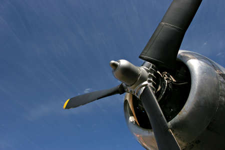 old propeller engine against blue sky