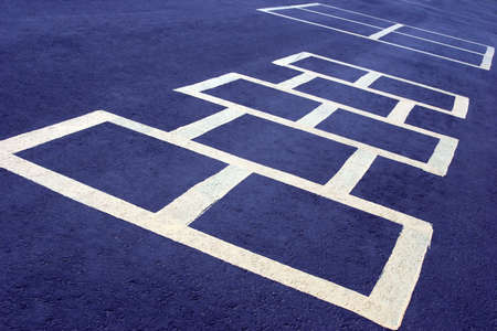 hopscotch game at a school, white board on blueの写真素材