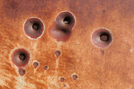 bullet hole background - rusting metalの写真素材