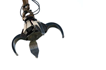 industrial claw used for transferring and recycling scrap metal, isolated over whiteの写真素材