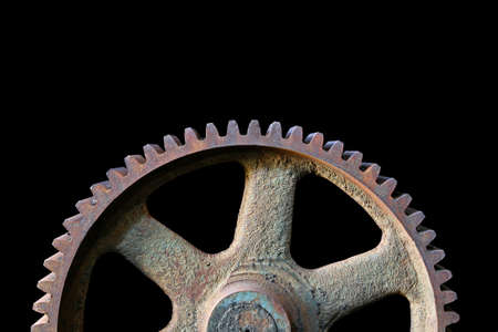 gear industrial - closeup of a large gear from an abandoned coal mine isolated over blackの写真素材