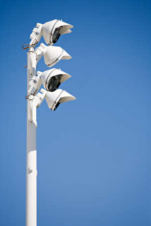 spotlights - white lights in modern design against blue sky with copyspaceの写真素材