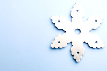 snowflake background - chrome snowflake high key on light blue with copyspaceの写真素材