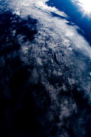 clouds and sky with rays of sunshineの写真素材