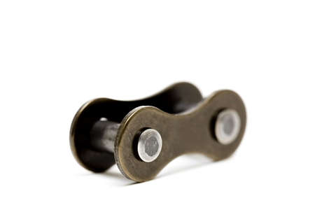 the missing link - macro of single chain element isolated over white with copyspace. shallow depth of field, focus on front bolt.の写真素材
