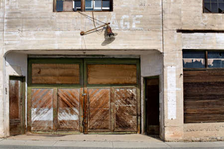 facade of an old and long abandoned garage in montana.の写真素材