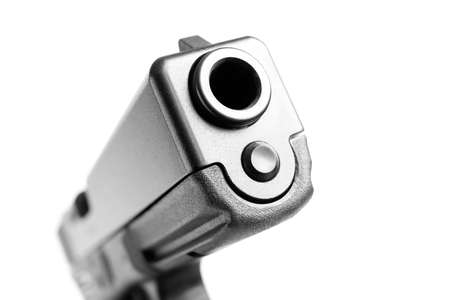 handgun macro isolated on white, shallow dof with focus on frontの写真素材