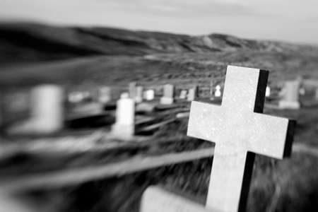 cross at an old cemetery. optical blur as shot, shallow dof. converted to bw with added grain.の写真素材