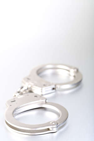 handcuffs closeup highkey with copyspaceの写真素材