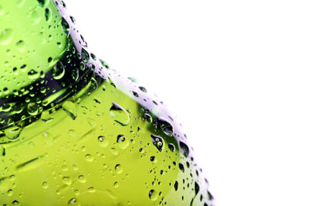 beer bottle abstract closeup, green wet bottle with water droplets, limited dof. の写真素材