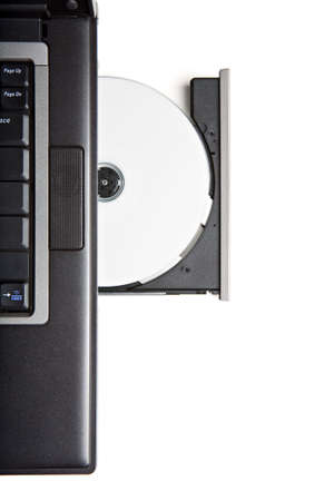 dvd cd in laptop drive - closeup isolated on white