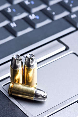 bullets 9mm on a laptop touch pad