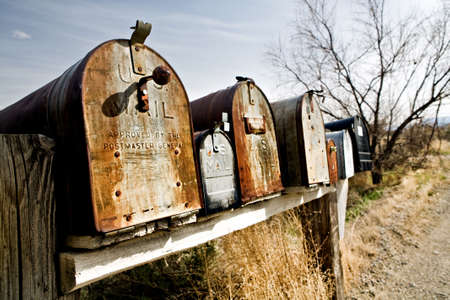 Old vintage mailboxes in rural Midwest United States, late sunの写真素材