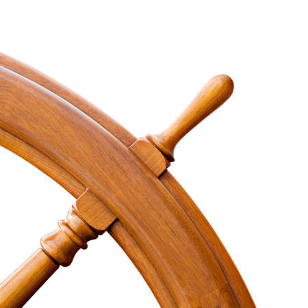 ship steering wheel or helm - closeup corner isolated on white. Restored from old windjammer.の写真素材