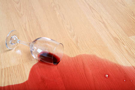 wine spill on wood - spilled glass of red wineの写真素材
