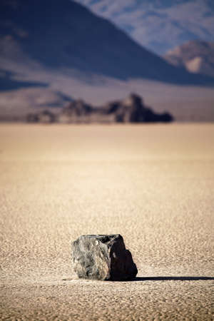 Death Valley National Park - lone rock in the middle of dry lake bed (Racetrack Playa)の写真素材