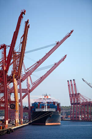 cargo ship in port - large container ship dockedの写真素材