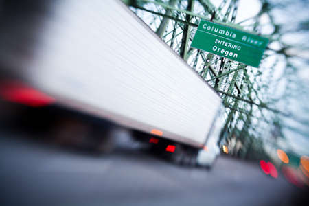 truck on Interstate bridge crossing into Oregon. Angled, shot with a lensbaby - very shallow focus.の写真素材