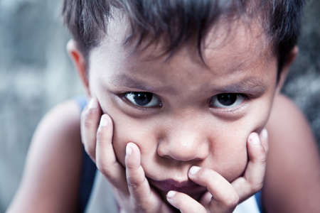 Asian boy portrait - Filipino child contemplating closeup, shallow dofの写真素材