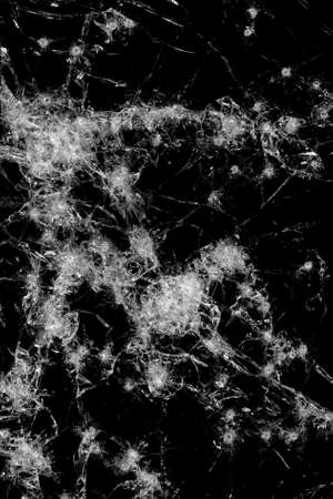 broken glass abstract background - glass shot with shotgun isolated on blackの写真素材