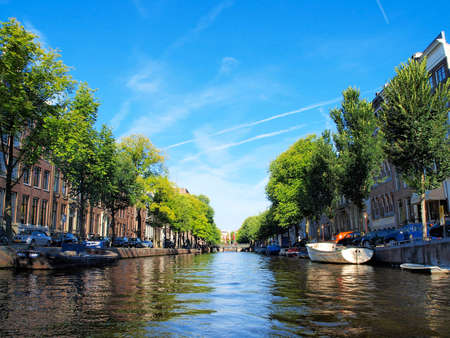 Boats and houses along the canals of Copenhagen, Denmark.のeditorial素材