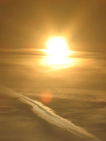 sun, sky and airpalne stripeの写真素材