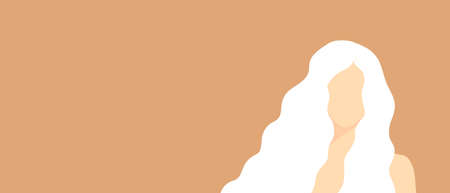 Beautiful albino woman with long wavy hair on a soft orange background with copy space