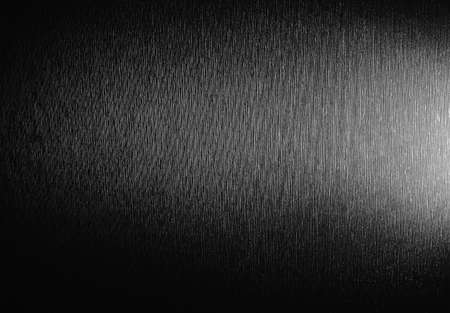 Black metallic gradient texture background with highlight