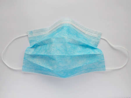 Medical sterile blue protective mask on a white background