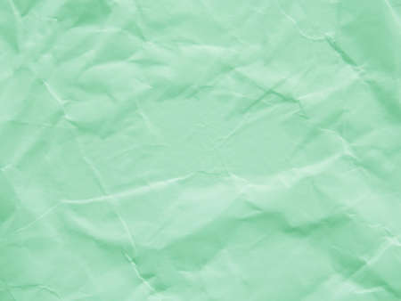 Mint green crumpled paper texture backgroundの写真素材