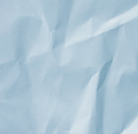 Light blue crumpled paper texture backgroundの写真素材