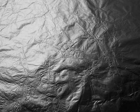 Gray metal matte foil with gradient. Crumpled textureの写真素材