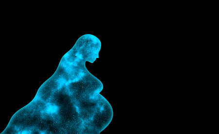 Blue shining universe in the shape of a pregnant woman on a black backgroundの写真素材