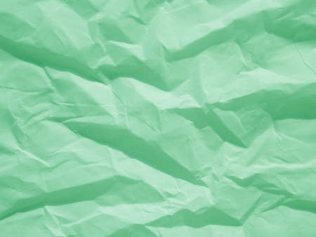Mint green crumpled paper texture backgroundの写真素材